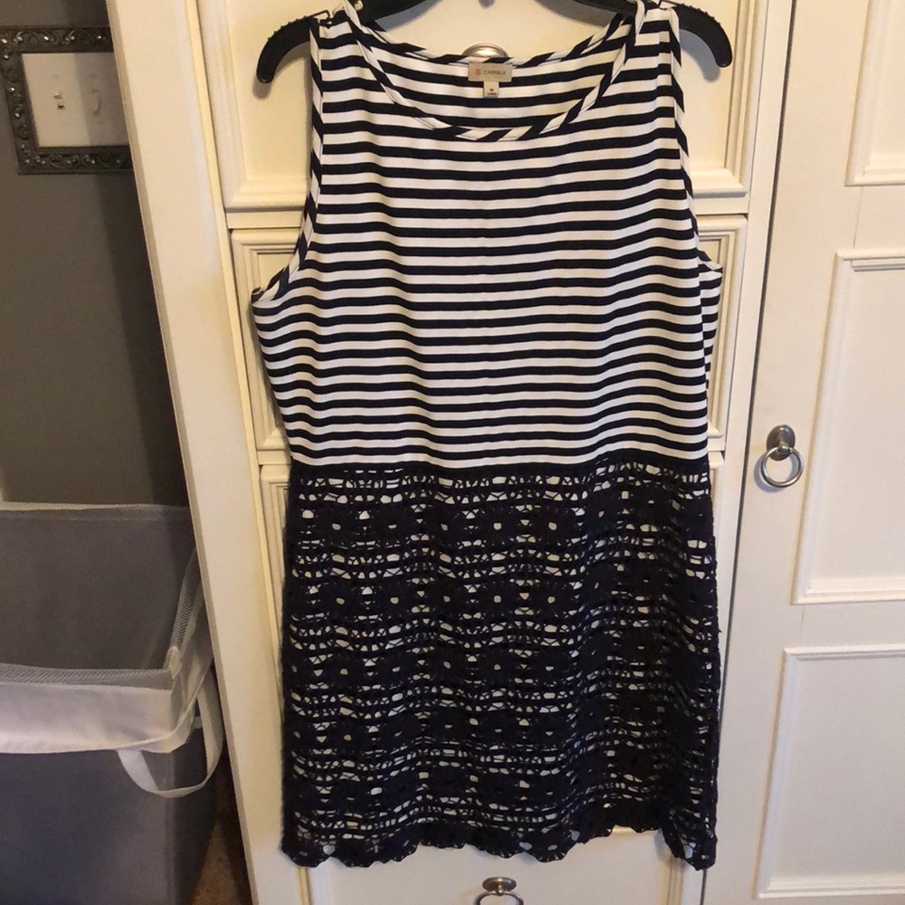 Navy and white striped dress with lace overlay.